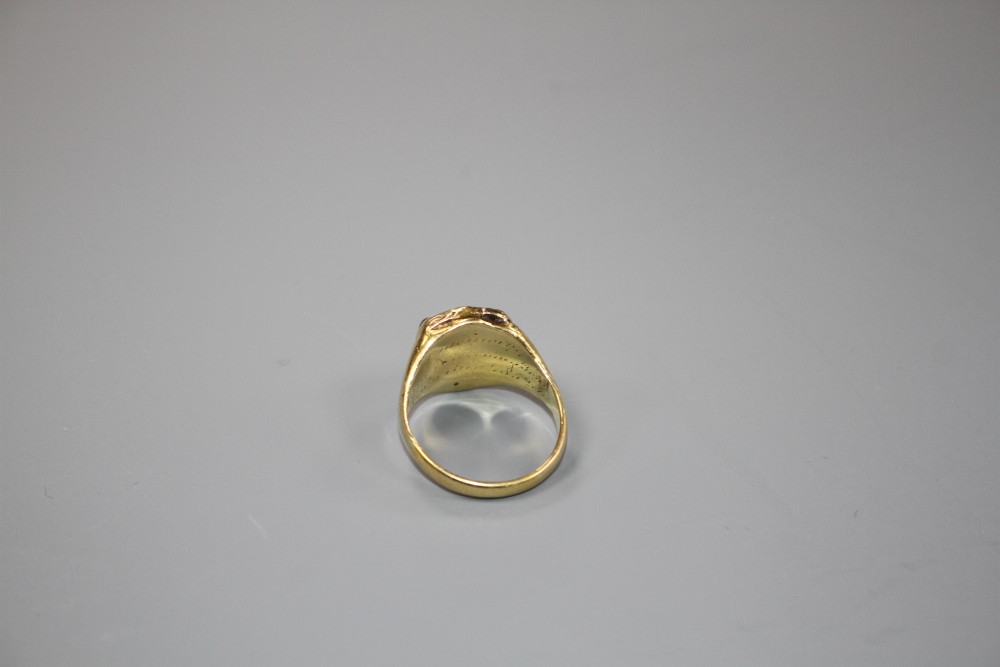 A Victorian yellow metal (probably 18ct) and shield shaped sardonyx poison ring, size L/M, gross weight 5.2 grams.